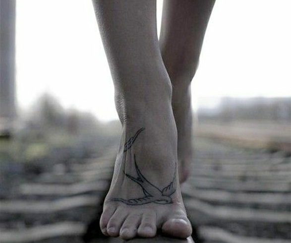 Birdie tattoo on foot