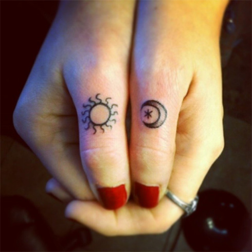 Cute sun and moon tattoo on thumb