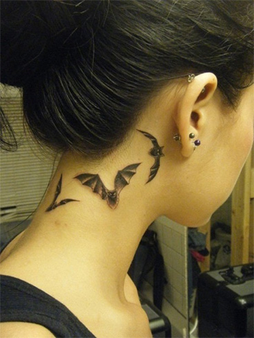 Bat tattoo on neck