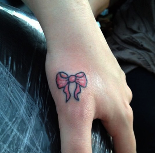 Colorful bow tattoo for hand
