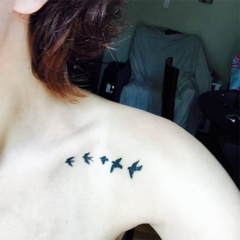 Flying sparrow tattoo on shoulder