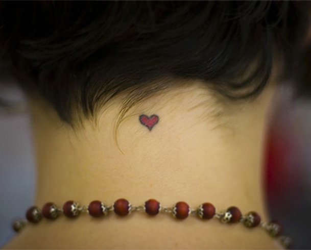 Red heart tattoo on neck