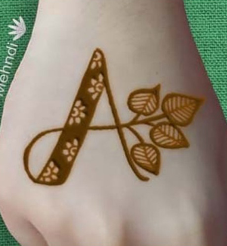 A letter henna design with leaves