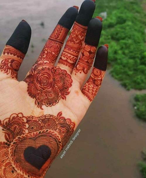 Intricate Heart Mehendi Design On Palm