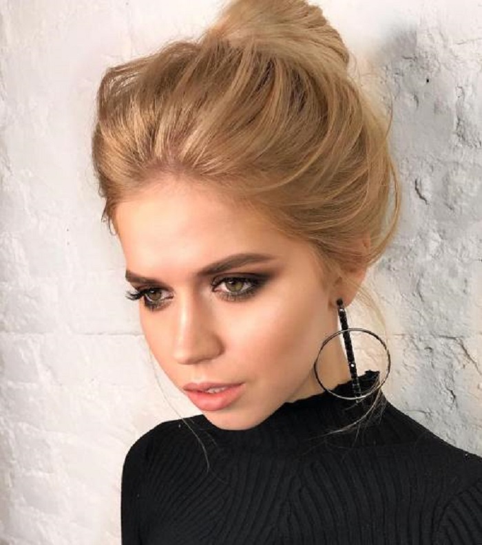updo hairstyle with black cocktail dress